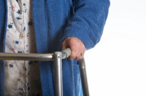 Elderly person using a walker. 