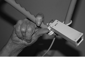 older person's hand within nursing home