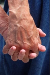 older couple holding hands