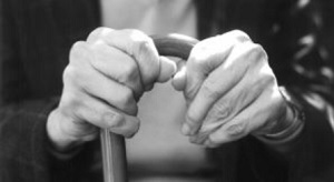 older woman holding a cane