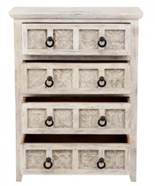 White wooden dresser with black handles on the drawers