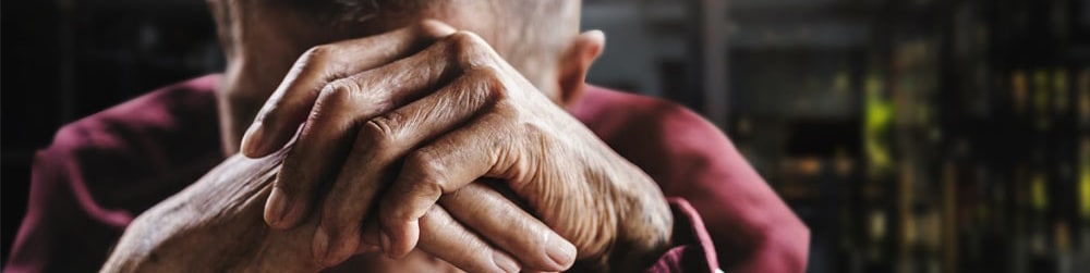 neglected man covering his face hands